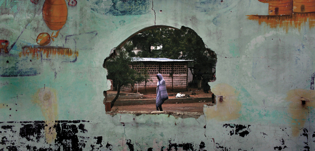 Hole in a wall, Mogadishu, August 2009. For the first time in decades, Somalia’s leader, President Sheik Sharif Sheik Ahmed, has both widespread grassroots support inside the country and extensive help from foreign governments.