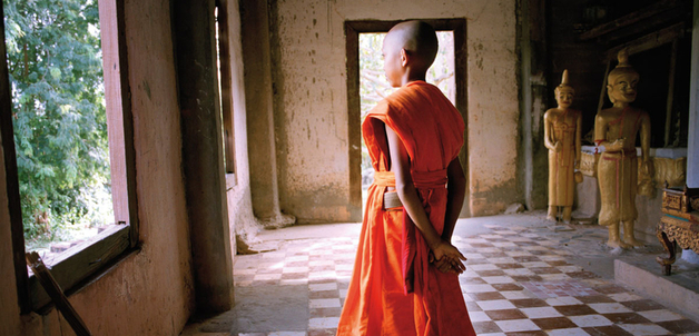 Young monk in an ancient temple in the Angkor Wat complex, Cambodia, June 2007